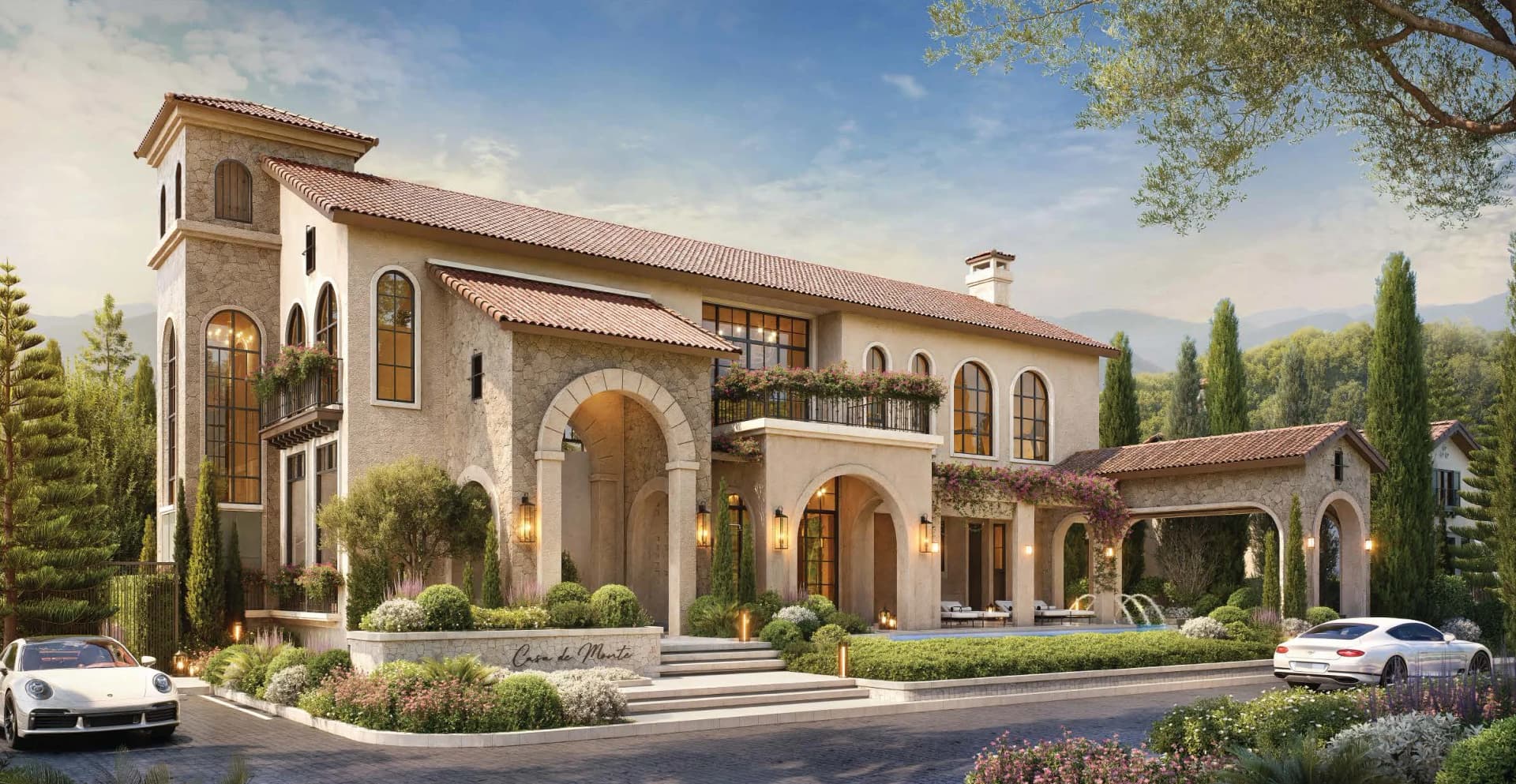 The Tuscan clubhouse: stone tower, arched loggia and terracotta roofs